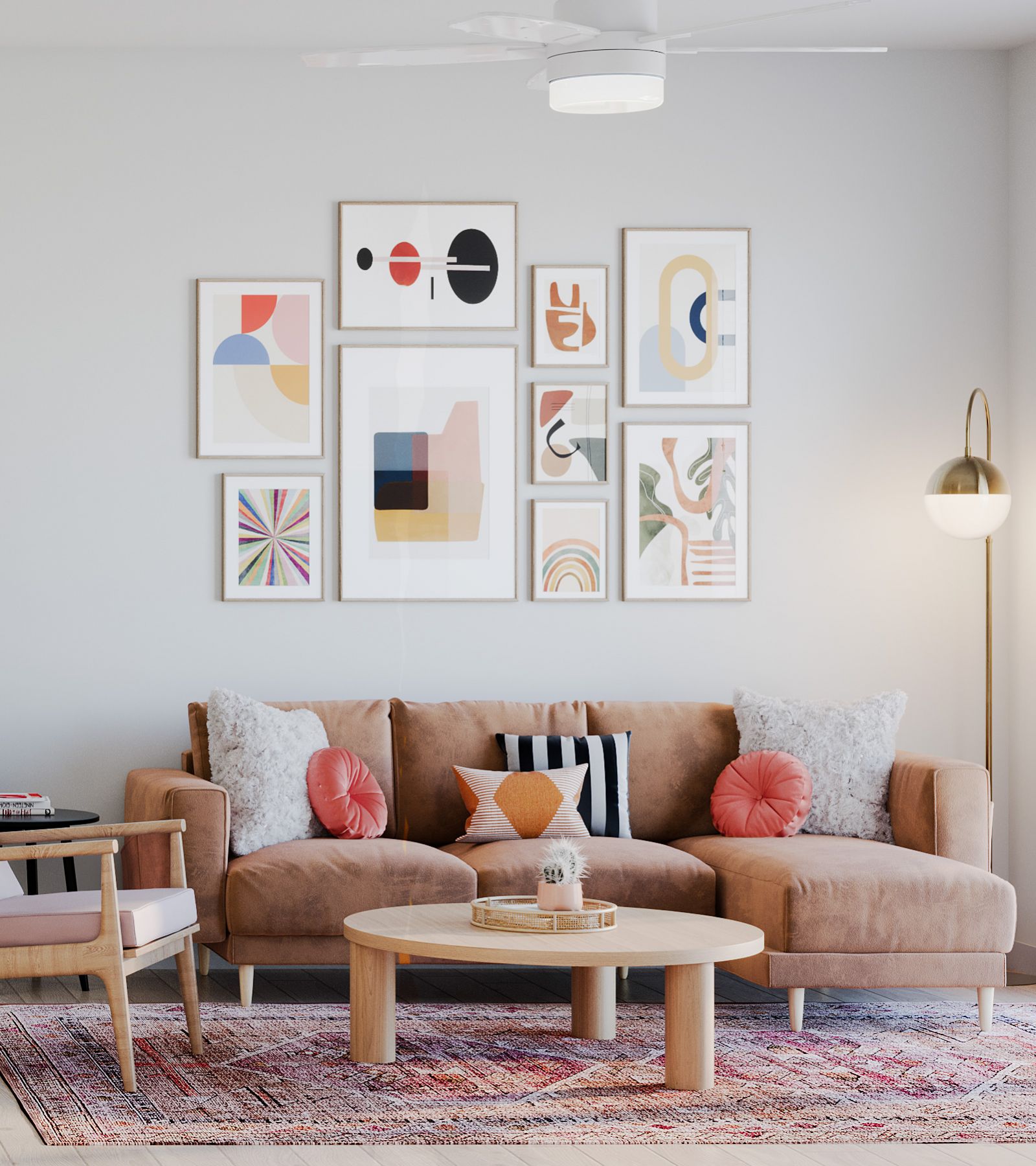 Wixby House Modern living room with tan sofa, colorful pillows, abstract wall art, round table, and floor lamp.