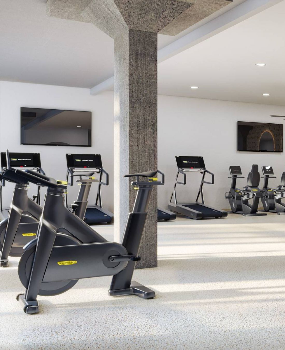 Wixby House Spacious gym with cardio machines, weights, benches, large mirrors, and ceiling fans in a bright, modern room.