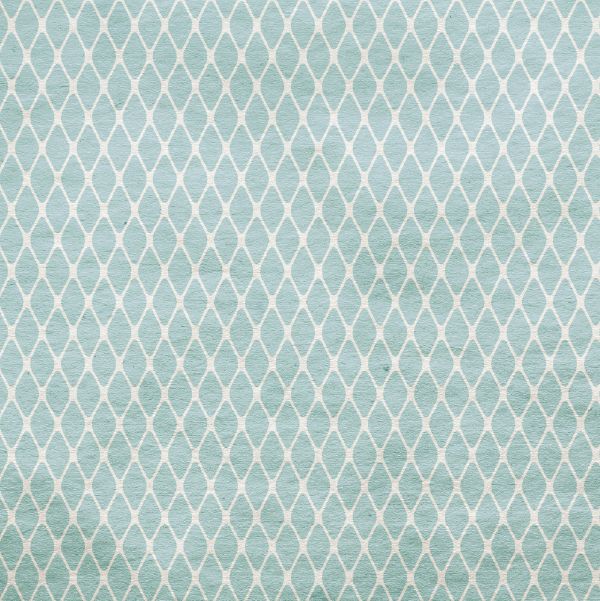 Wixby House Light blue patterned surface with a repeating white diamond lattice design.