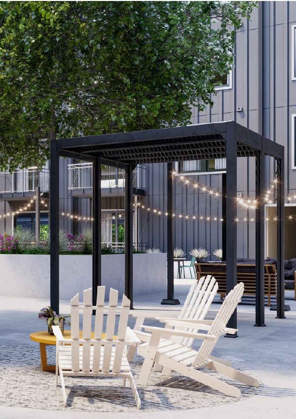 Wixby House Four white Adirondack chairs around a fire pit under string lights and a black pergola in a modern courtyard.